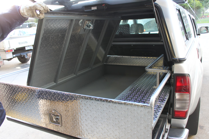 slide out tool box in back of ute in extended position with top open